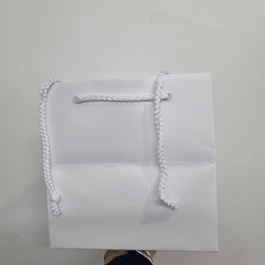 Vox box, white carrier bag
